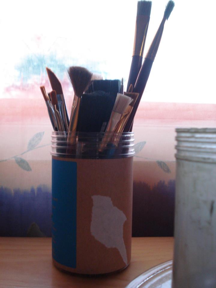 Can with paint brushes