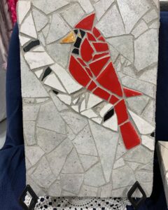 Mosaic tile cardinal on tree branch
