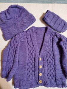 Purple knitted doll clothes