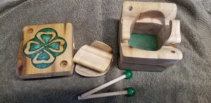 Carved box with green clover