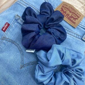 Blue scrunchies on a pair of jeans