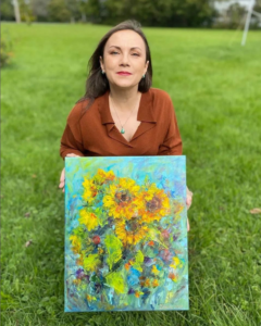 Woman with painting of flowers