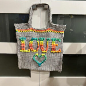 Crocheted handbag with word "love"