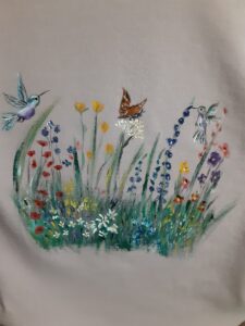 Embroidered flowers, hummingbird and butterfly