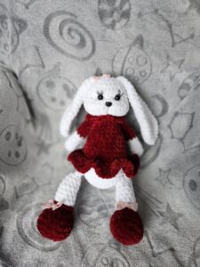 Crocheted rabbit in red dress