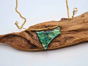 Turquoise necklace on gold chain